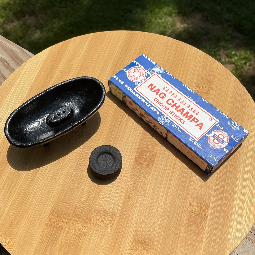 Cast iron incense boat with removable stick holder, charcoal disk, and incense